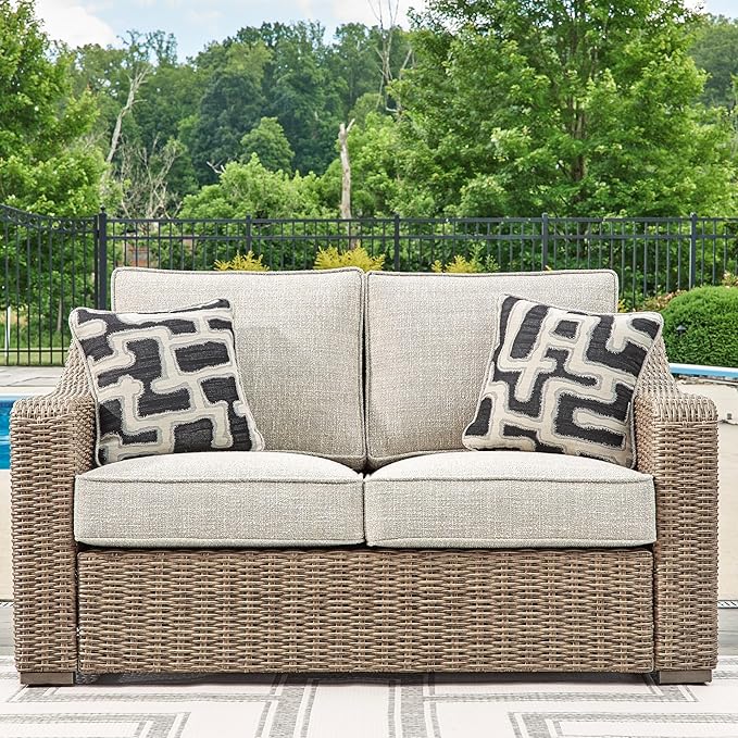 Signature Design by Ashley Beachcroft Casual Nuvella Weather Resistant Fabric, Resin Wicker Outdoor Loveseat with Cushion and 2 Accent Pillows, Dark Brown & Beige
